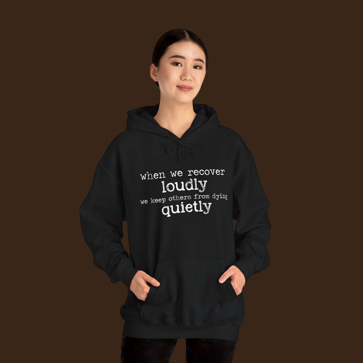 Recover Loudly unisex hoodie in black, front, worn by a model
