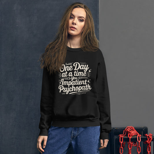 One Day at a Time You Impatient Psychopath crewneck in black, worn by a model, front.