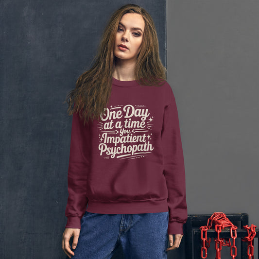 One Day at a Time You Impatient Psychopath crewneck in maroon, worn by a model, front.