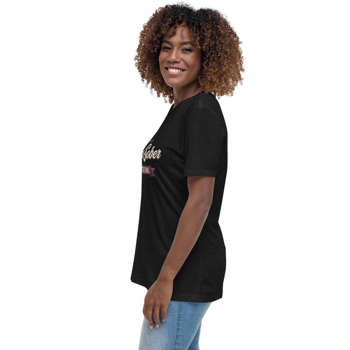 Woman wearing the black Certified Sober, Still a Little Feral relaxed tee, side view