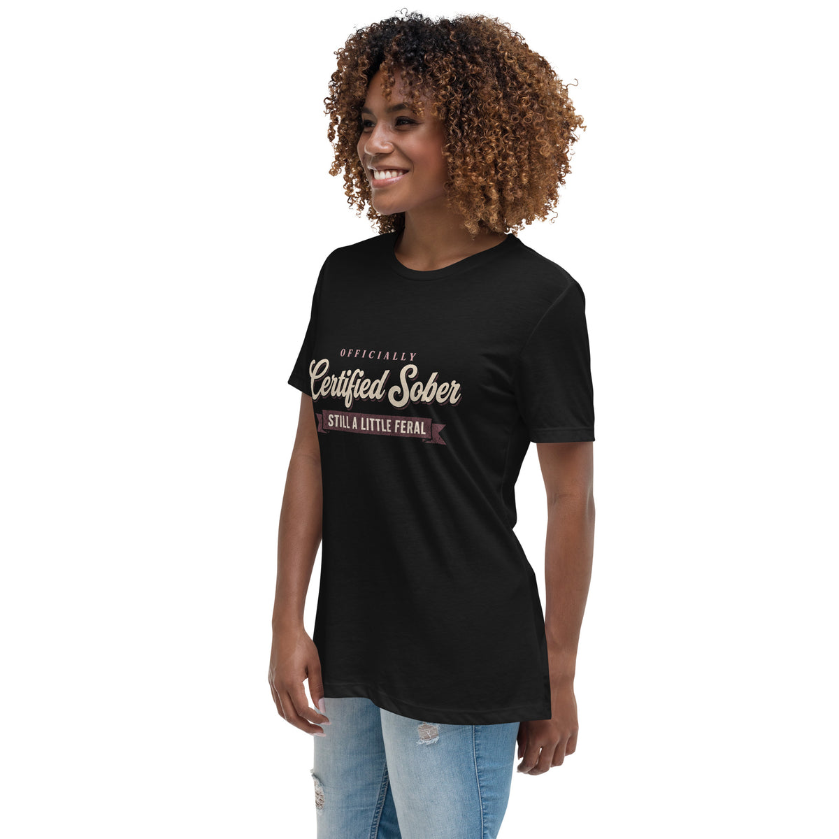 Woman wearing the black Certified Sober, Still a Little Feral relaxed tee, side view