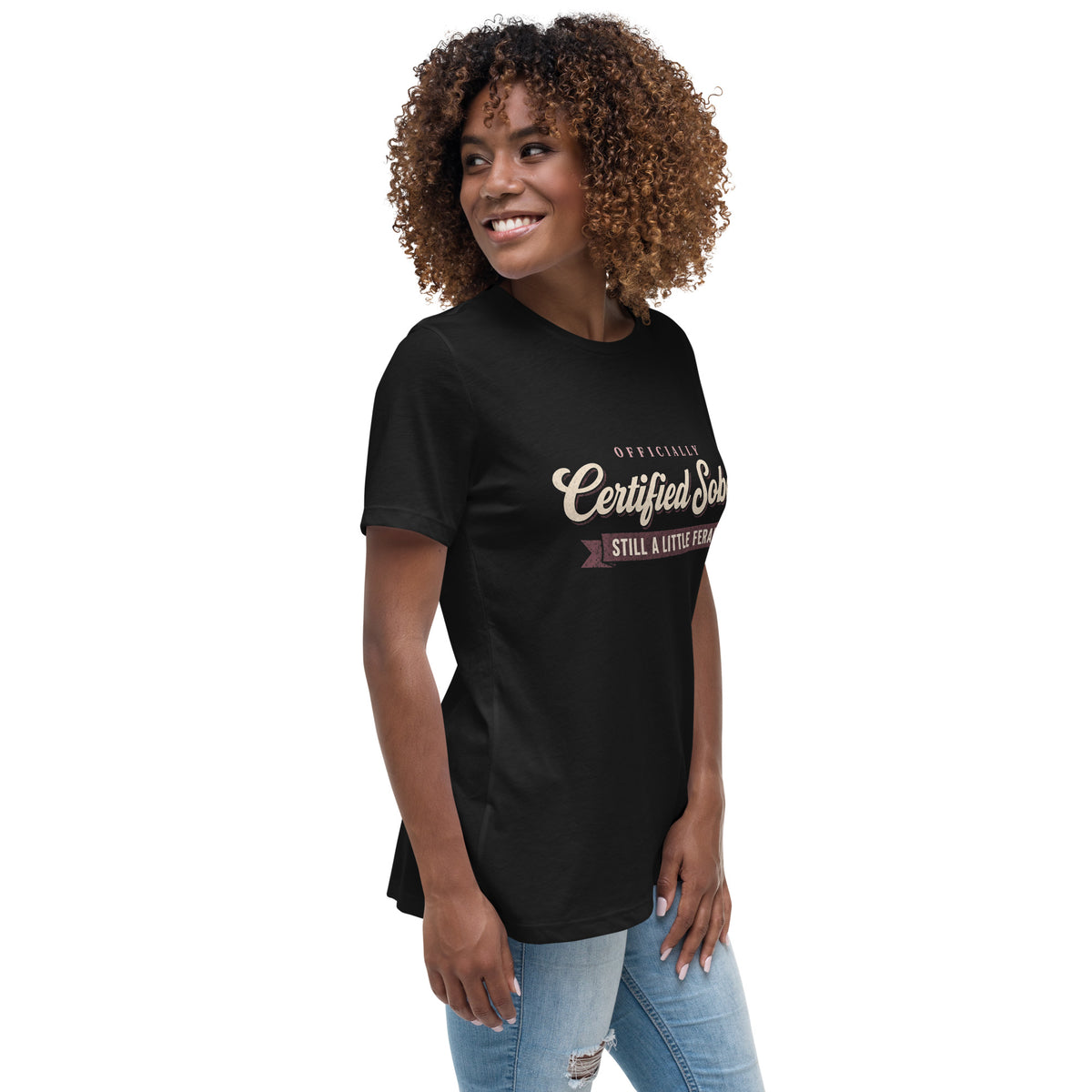 Woman wearing the black Certified Sober, Still a Little Feral relaxed tee, side view