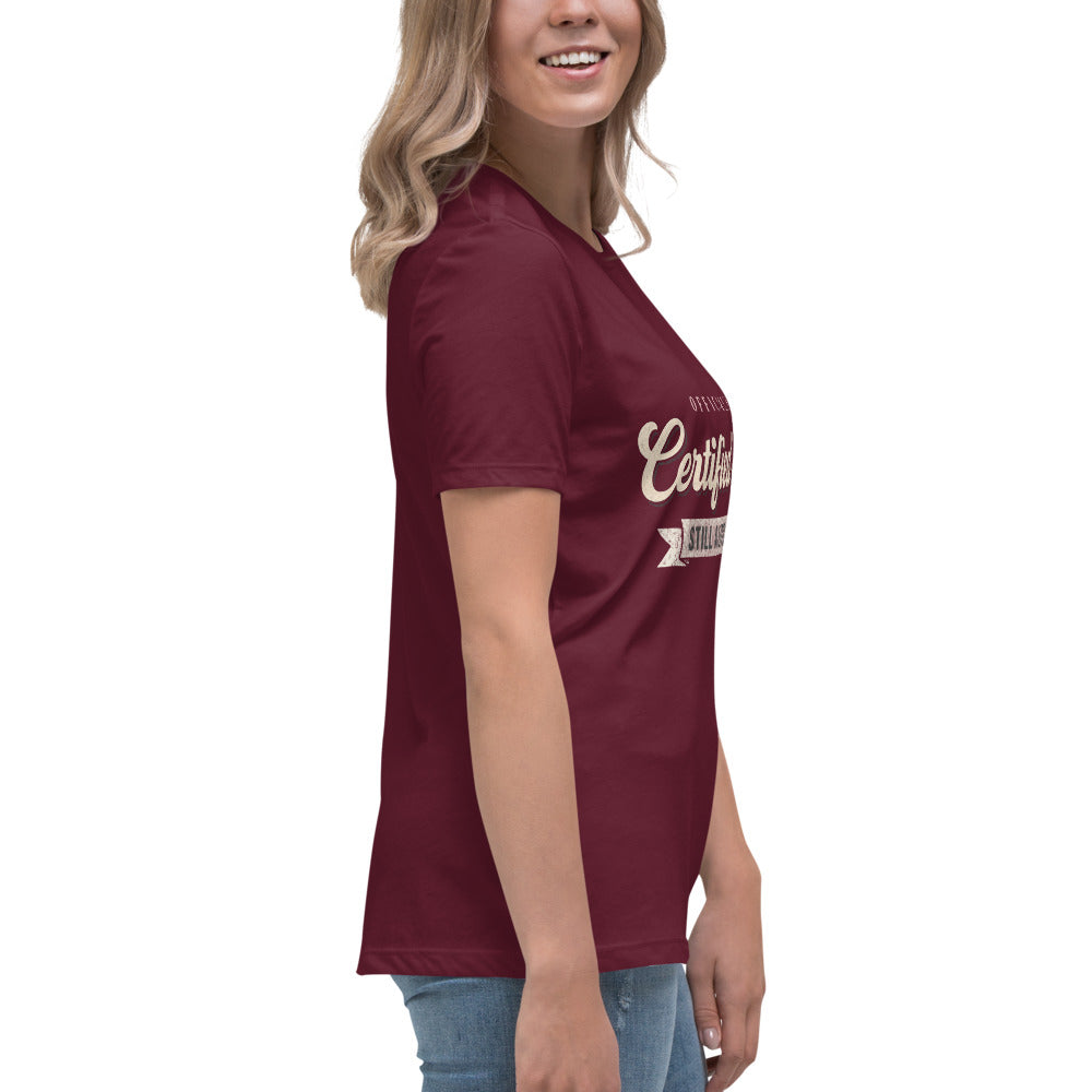 Woman wearing the maroon Certified Sober, Still a Little Feral relaxed tee, side view