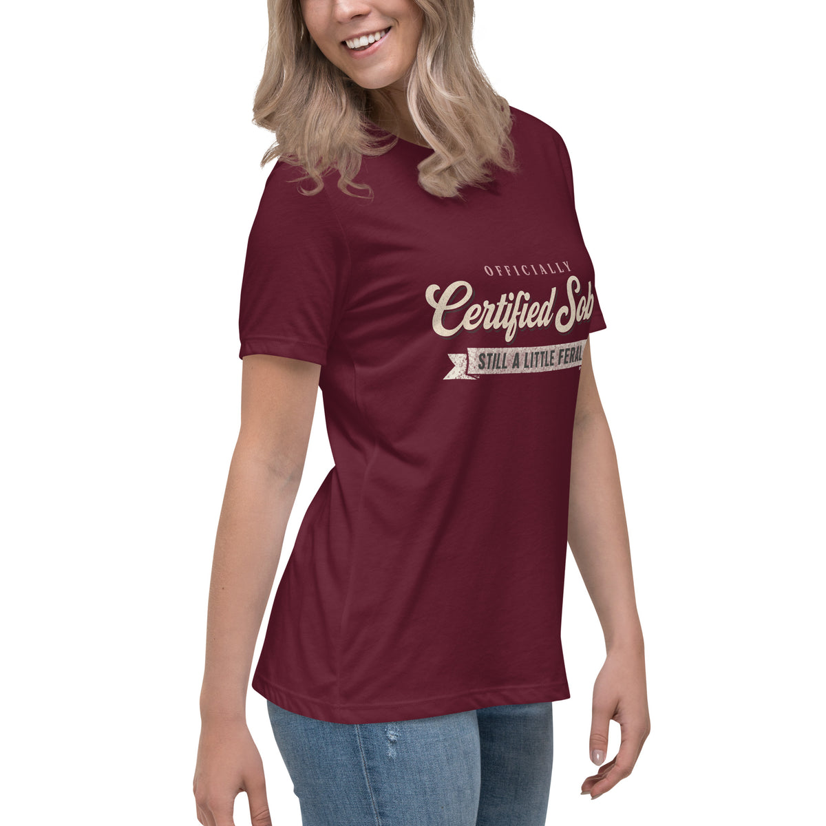 Woman wearing the maroon Certified Sober, Still a Little Feral relaxed tee, side view